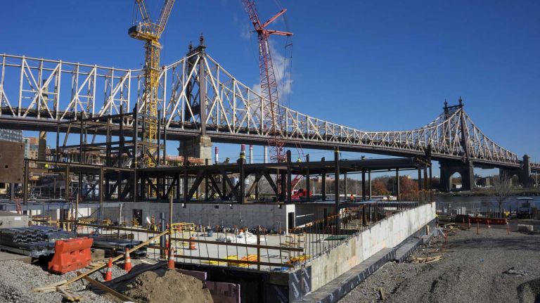 With the Ed Koch Bridge across and above Roosevelt Island in the background, the Cornell Tech construction project is seen Tuesday, Nov. 17, 2105. Development of the first phase of the campus is currently underway and due to open in 2017. A tour of the project included views of steel and other materials rising for each building as part of phase one, The Bloomberg Center, named in honor of Emma and Georgina Bloomberg, The Bridge (center), where companies will locate on campus, and a residential building for faculty, staff and students, which will be the first Passive House residential high-rise in the world.