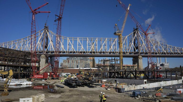 With the Ed Koch Bridge across and above Roosevelt Island in the background, the Cornell Tech construction project is seen Tuesday, Nov. 17, 2105. Development of the first phase of the campus is currently underway and due to open in 2017. A tour of the project included views of steel and other materials rising for each building as part of phase one, The Bloomberg Center, named in honor of Emma and Georgina Bloomberg, The Bridge, where companies will locate on campus, and a residential building for faculty, staff and students, which will be the first Passive House residential high-rise in the world.
