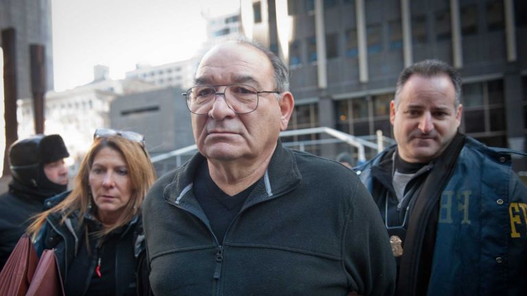 Thomas DiFiore, 70, of Commack, the Bonanno family's alleged street boss, is led out from Federal Plaza after his arrest on charges of extortion and loan sharking-related counts. DiFiore pleaded not guilty Thursday and was detained without bail. (Jan. 23, 2014) 