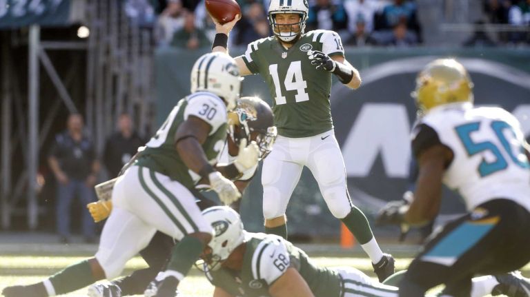 Ryan Fitzpatrick #14 of the New York Jets throws a pass in the first half against the Jacksonville Jaguars to teammate Zac Stacy #30 at MetLife Stadium on Sunday, Nov. 8, 2015 in East Rutherford, N.J.