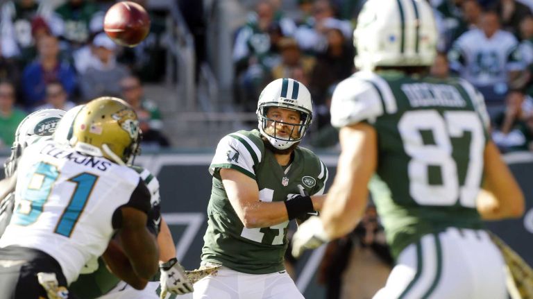 Ryan Fitzpatrick #14 of the New York Jets throws a pass in the first half against the Jacksonville Jaguars to teammate Eric Decker #87 at MetLife Stadium on Sunday, Nov. 8, 2015 in East Rutherford, N.J.