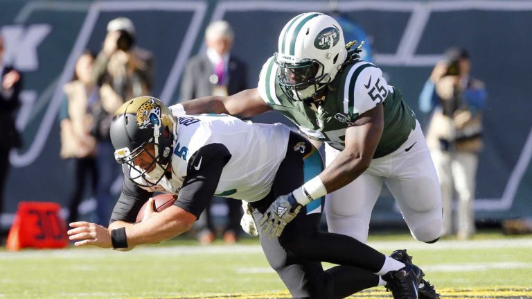 Blake Bortles #5 of the Jacksonville Jaguars is stopped on a run in the first half by Lorenzo Mauldin #55 of the New York Jets at MetLife Stadium on Sunday, Nov. 8, 2015 in East Rutherford, N.J.