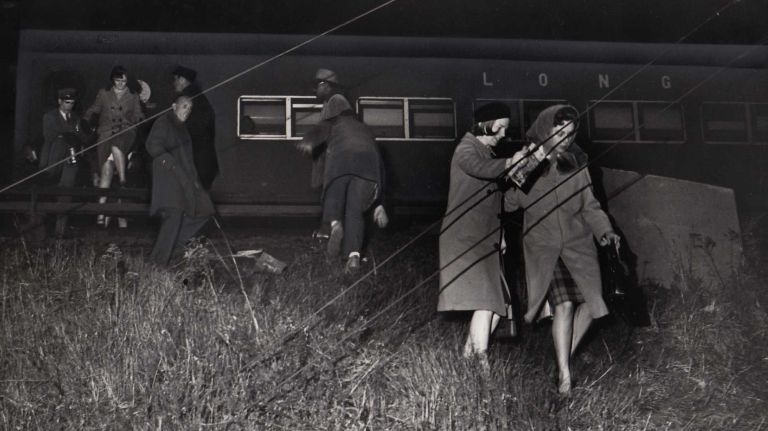 Passengers exit a stalled train on the LIRR tracks in Jamaica during the blackout on Nov. 9, 1965. The embankment led to the street below.