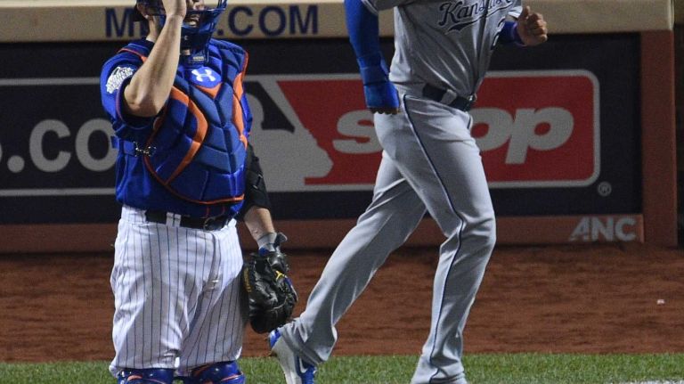 World Series Game 5: Mets vs. Royals 102 New York Mets catcher Travis d'Arnaud stands at home plate after Kansas City Royals shortstop Christian Colon scores during the 12th inning of Game 5 of the World Series at Citi Field on Sunday, Nov. 1, 2015.