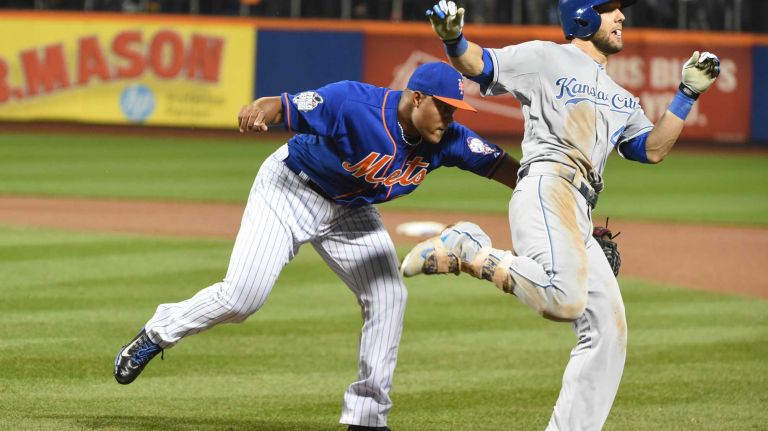 World Series Game 5: Mets vs. Royals 124 New York Mets relief pitcher Jeurys Familia (27) tags out Kansas City Royals leftfielder Alex Gordon (4) for the final out in ninth inning during Game 5 of the World Series at Citi Field on Sunday, Nov. 1, 2015.