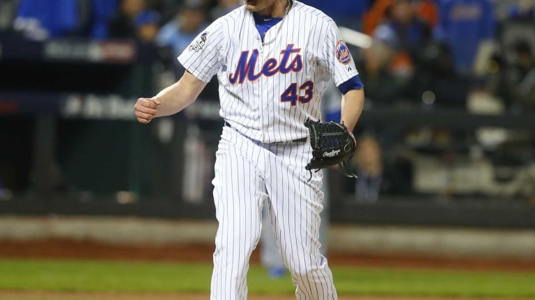 New York Mets relief pitcher Addison Reed reacts in the seventh inning after he gets out of it during Game 4 of the World Series against the Kansas City Royals at Citi Field on Saturday, Oct. 31, 2015.