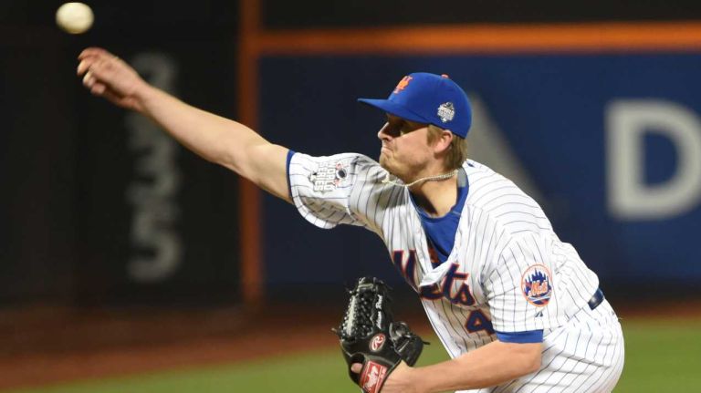New York Mets relief pitcher Addison Reed (43) delivers the pitch in the seventh inning during Game 4 of the World Series against the Kansas City Royals at Citi Field on Saturday, Oct. 31, 2015.