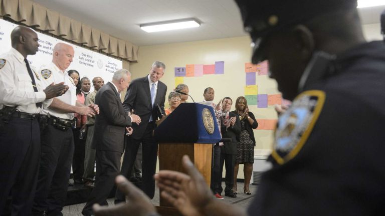 New York City Mayor Bill de Blasio, New York City Police Commissioner William J. Bratton and others hold a news conference at Cardinal Spellman in the Bronx on Wednesday, July 15, 2015. Mayor de Blasio and Police Commissioner Bratton discussed a reduction in crime in the 47th precinct attributed to the NYPD's Summer All Out program. 