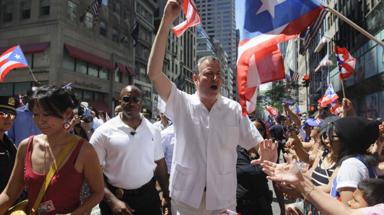 New York City Mayor Bill de Blasio marches in the 57th Annual National Puerto Rican Day Parade in Manhattan on Sunday, June 8, 2014.