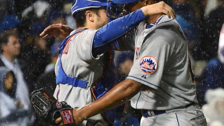 NLCS Game 3: Mets vs. Cubs 38 New York Mets catcher Travis d'Arnaud (7) and New York Mets relief pitcher Jeurys Familia (27) react after the final out in the ninth inning during Game 3 of the NLCS against the Chicago Cubs at Wrigley Field on Tuesday, Oct. 20, 2015.