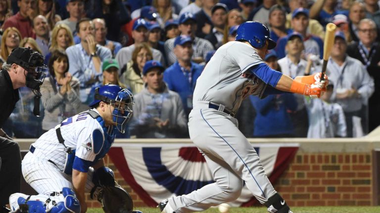 NLCS Game 3: Mets vs. Cubs 45 Chicago Cubs catcher Miguel Montero (47) cannot stop the ball as New York Mets leftfielder Michael Conforto (30) strikes out and New York Mets centerfielder Yoenis Cespedes (52) scores in the sixth inning during Game 3 of the NLCS at Wrigley Field on Tuesday, Oct. 20, 2015.