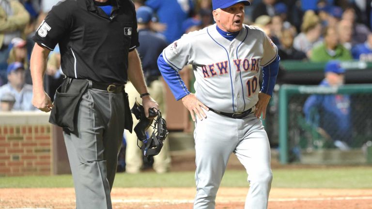 NLCS Game 3: Mets vs. Cubs 48 New York Mets manager Terry Collins (10) argues the call with umpire Ted Barrett (65) after New York Mets shortstop Wilmer Flores (4) hits a ground-rule double into the ivy during Game 3 of the NLCS against the Chicago Cubs at Wrigley Field on Tuesday, Oct. 20, 2015.