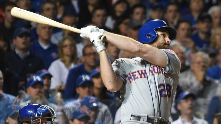 NLCS Game 3: Mets vs. Cubs 54 New York Mets second baseman Daniel Murphy hits a solo home run in the third inning during Game 3 of the NLCS against the Chicago Cubs at Wrigley Field on Tuesday, Oct. 20, 2015.