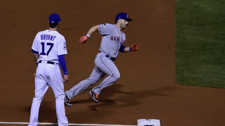 NLCS Game 3: Mets vs. Cubs 62 New York Mets third baseman David Wright (5) rounds third base and scores on a double by New York Mets centerfielder Yoenis Cespedes (52) in the first inning during Game 3 of the NLCS against the Chicago Cubs at Wrigley Field on Tuesday, Oct. 20, 2015.