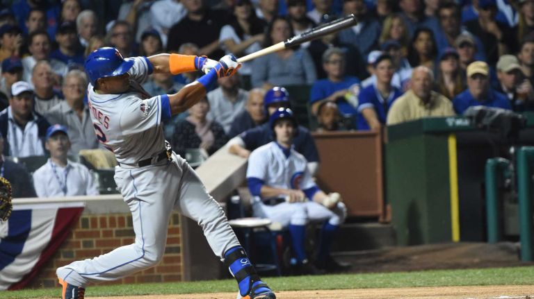 NLCS Game 3: Mets vs. Cubs 63 New York Mets centerfielder Yoenis Cespedes (52) hits an RBI double in the first inning during Game 3 of the NLCS against the Chicago Cubs at Wrigley Field on Tuesday, Oct. 20, 2015.