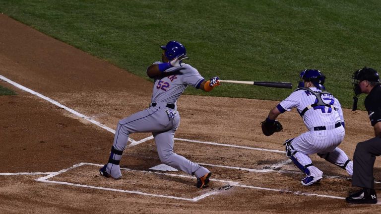 NLCS Game 3: Mets vs. Cubs 64 New York Mets centerfielder Yoenis Cespedes (52) hits an RBI double in the first inning during Game 3 of the NLCS against the Chicago Cubs at Wrigley Field on Tuesday, Oct. 20, 2015.