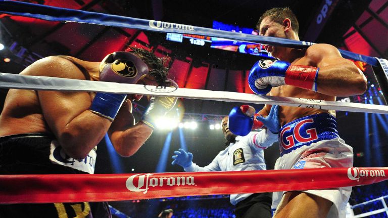 The referee stops the fight on a technical knockout as middleweight Gennady Golovkin defeats David Lemieux during World Championship Boxing at Madison Square Garden in New York, New York on Sunday, Oct 18, 2015.