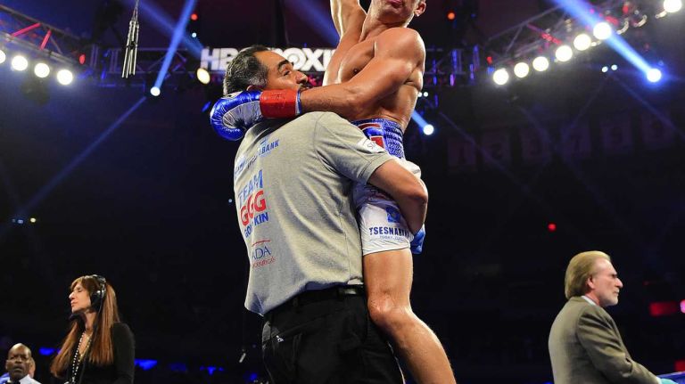 Middleweight Gennady Golovkin is held up by his coach after defeating David Lemieux during World Championship Boxing at Madison Square Garden in New York, New York on Sunday, Oct 18, 2015.