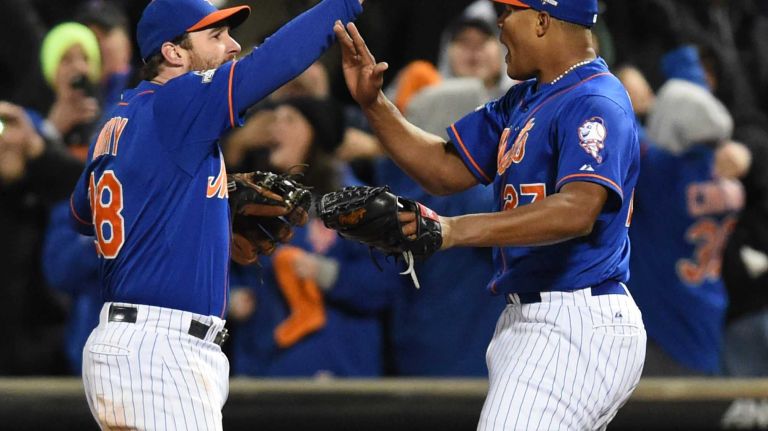 New York Mets second baseman Daniel Murphy (28) and New York Mets relief pitcher Jeurys Familia (27) celebrate the win during Game 2 of the NLCS against the Chicago Cubs at Citi Field on Sunday, Oct. 18, 2015.