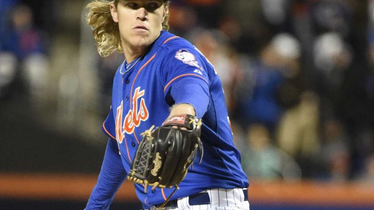 New York Mets starting pitcher Noah Syndergaard (34) delivers the pitch i the first inning during Game 2 of the NLCS against the Chicago Cubs at Citi Field on Sunday, Oct. 18, 2015.