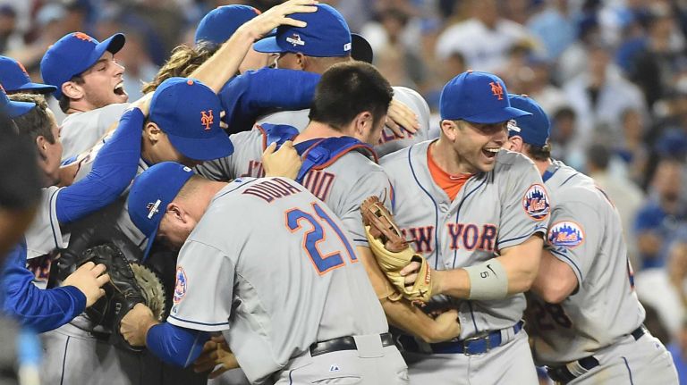 The New York Mets celebrate their National League Division Series victory over the Los Angeles Dodgers at Dodger Stadium in Los Angeles on Oct. 15, 2015.