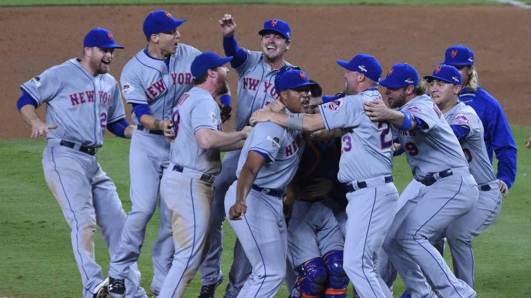 The New York Mets celebrate their National League Division Series victory over the Los Angeles Dodgers at Dodger Stadium in Los Angeles on Oct. 15, 2015.