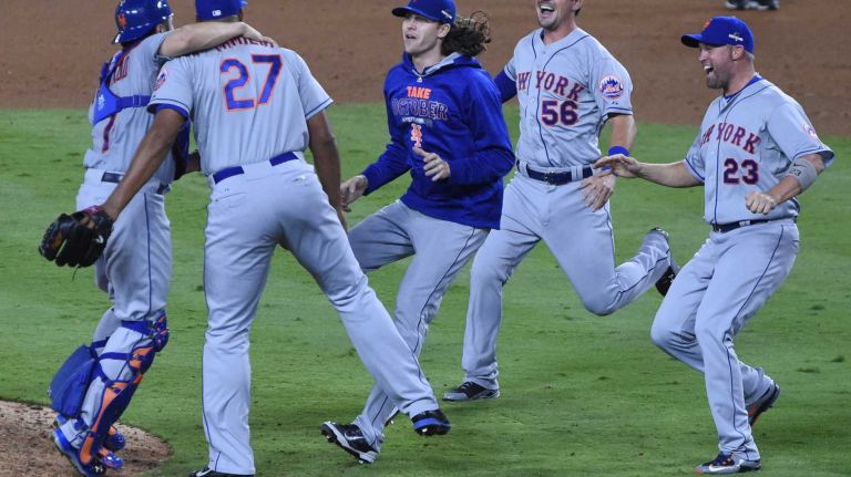 The New York Mets celebrate their National League Division Series victory over the Los Angeles Dodgers at Dodger Stadium in Los Angeles on Oct. 15, 2015.