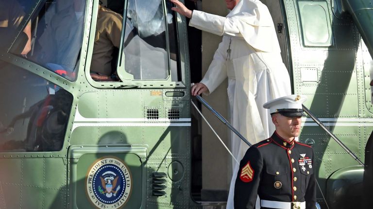 Pope Francis leaves via helicopter for New York City after arriving at John F. Kennedy Airport in New York, Sept. 24, 2015. Pope Francis is on a five-day trip to the USA, which includes stops in Washington DC, New York and Philadelphia, after a three-day stay in Cuba. On the left is Diocese of Brooklyn Bishop Nicholas DiMarzio.