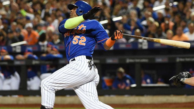 Subway Series: Yankees vs. Mets 53 New York Mets left fielder Yoenis Cespedes swings while at bat against the New York Yankees during the first inning of a baseball game at Citi Field on Sunday, Sept. 20, 2015.