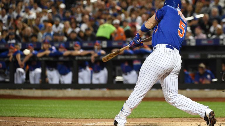 Subway Series: Yankees vs. Mets 57 New York Mets third baseman David Wright hits an RBI double against the New York Yankees during the first inning of a baseball game at Citi Field on Sunday, Sept. 20, 2015.
