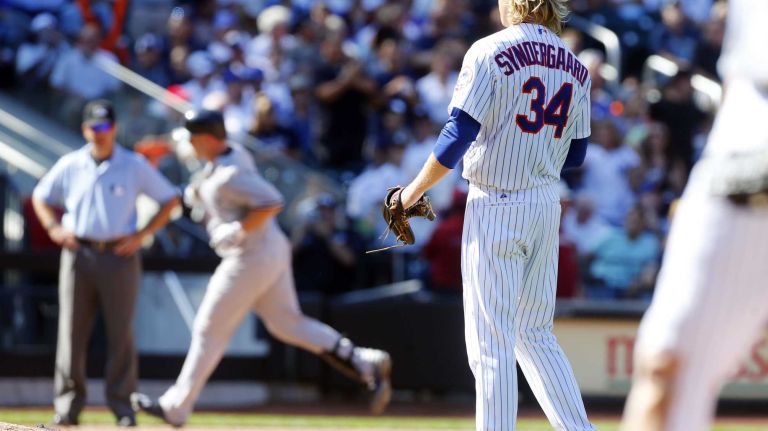 Subway Series: Yankees vs. Mets 63 Noah Syndergaard #34 of the New York Mets watches Brian McCann #34 of the New York Yankees runs the bases after his sixth inning two run home run at Citi Field on Saturday, Sept. 19, 2015.