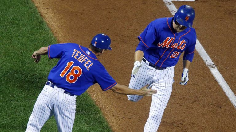Subway Series: Yankees vs. Mets 87 Lucas Duda of the New York Mets celebrates his second-inning home run against the New York Yankees with third base coach Tim Teufel at Citi Field on Friday, Sept. 18, 2015.