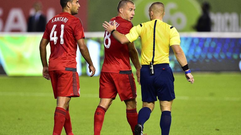 Toronto FC midfielder Benoit Cheyrou argues with referee Chris Penso after New York City FC midfielder Frank Lampard (not shown) scores a first-half goal in an MLS game at Yankee Stadium on Wednesday, Sept. 16, 2015.