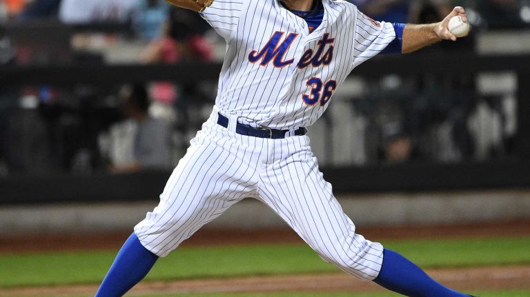 Mets relief pitcher Sean Gilmartin delivers a pitch against the Miami Marlins during the sixth inning of a baseball game at Citi Field on Monday, Sept. 14, 2015.