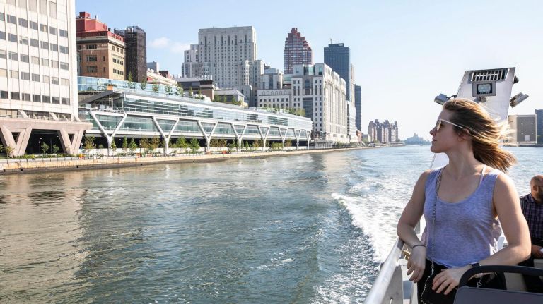 Bronx transportation options now include NYC Ferry service to Manhattan 3 Andrea Larsen of Yorkville gazes at the cityscape as she rides the NYC Ferry down to Wall Street, Aug. 15.