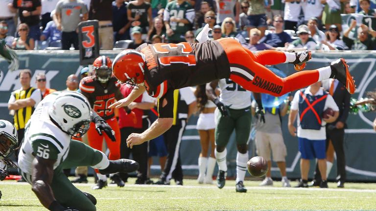 Jets vs. Browns 9 Josh McCown #13 of the Cleveland Browns is upended by Demario Davis #56 of the New York Jets in the first quarter of a game at MetLife Stadium on Sunday, Sept. 13, 2015 in East Rutherford, N.J.