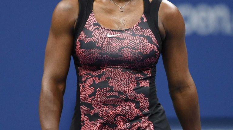 Serena Williams looks on against Venus Williams during the women's singles quarterfinals at the U.S. Open tennis tournament on Tuesday, Sept. 8, 2015.