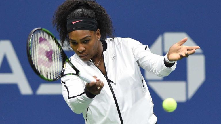 Serena Williams warms up against Venus Williams during the women's singles quarterfinals at the U.S. Open tennis tournament on Tuesday, Sept. 8, 2015.