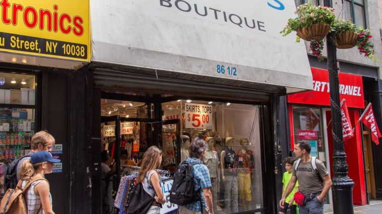 Pedestrians pass Lilly's Boutique in Manhattan's Financial District on Aug. 20, 2015.