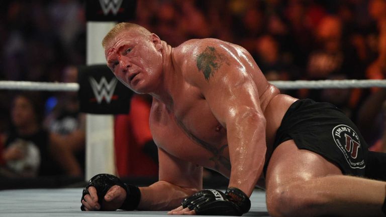 Brock Lesnar is down on the mat during his wrestling match against The Undertaker at the WWE SummerSlam 2015 at Barclays Center on Sunday, August 23, 2015.