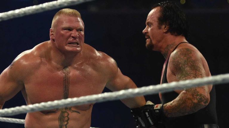 Brock Lesnar, left, and The Undertaker, wrestle during the WWE SummerSlam 2015 at Barclays Center on Sunday, Aug. 23, 2015.