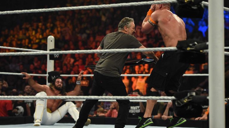 Jon Stewart hits United States Champion John Cena with a chair during the Title vs. Title match against WWE World Heavyweight Champion Seth Rollins during the SummerSlam 2015 at Barclays Center on Sunday, August 23, 2015.