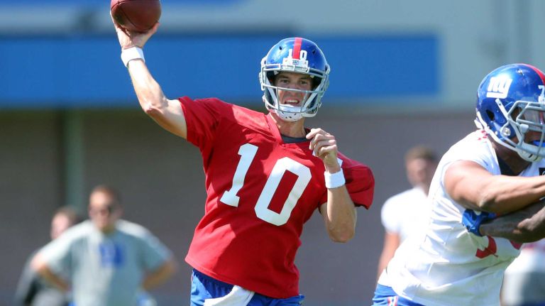 Giants quarterback Eli Manning throws a pass during training camp at the Quest Diagnostics Training Center in East Rutherford, New Jersey, on Friday, July 31, 2015.