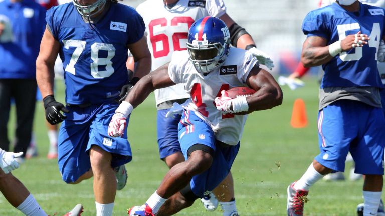 Giants running back Andre Williams runs the ball during training camp at the Quest Diagnostics Training Center in East Rutherford, New Jersey, on Friday, July 31, 2015.