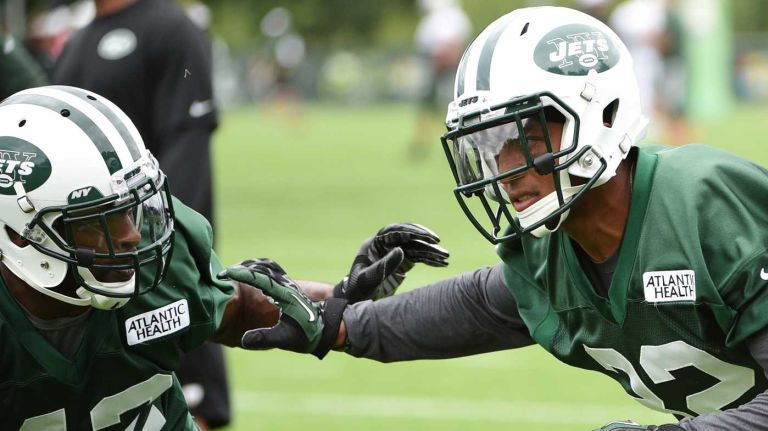 New York Jets cornerback Dashaun Phillips (32) runs drills against cornerback Keon Lyn at the Atlantic Health Training Center on Monday, Aug. 10, 2015 in Florham Park, N.J.