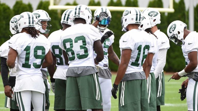 Members of the New York Jets offense huddle during practice at the Atlantic Health Training Center on Monday, Aug. 10, 2015 in Florham Park, N.J.