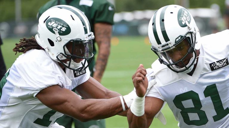 New York Jets wide receiver Shaq Evans (81) runs drills against wide receiver Saalim Hakim (19) at the Atlantic Health Training Center on Monday, Aug. 10, 2015 in Florham Park, N.J.