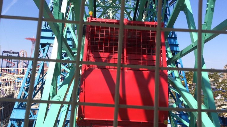 Passengers can either ride in stationary or swinging cars, like the red one seen here on May 25, 2015. 