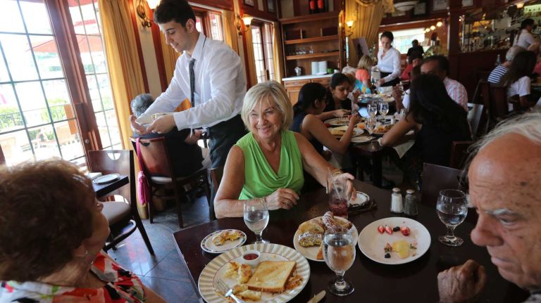 Phyllis Taibi, left, Ellie Aspinillo, and husband, Al, have lunch at Pasticceria Bruno, at 1650 Hylan Blbd. in Dongan Hills, Staten Island, Saturday, July 25, 2015.
