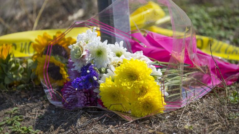 Flowers were placed on July 19, 2015 at the scene of a fatal accident between a limo and a pickup truck that killed four woman. The accident occurred on Route 48 and Depot Lane in Cutchogue. 